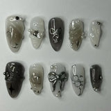 Taooba Christmas nail 24Pcs False Nails Spicy Girl Silver Bow with Diamond Fake Nails with Glue Almond Press on Nails Black Cool Y2k Almond Nail Set